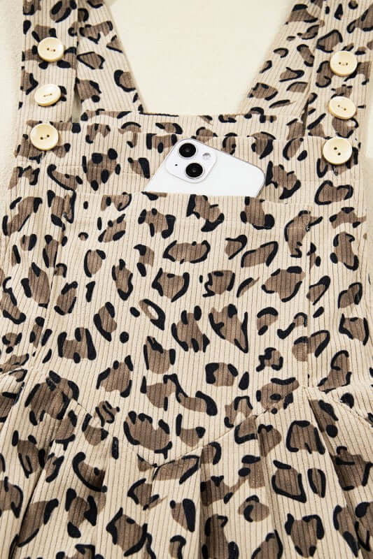 Leopard Bib Wide Leg Jumpsuit featuring a bold leopard print and button details with a phone pocket.