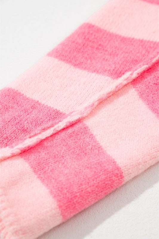 Close-up of pink striped Abigail High Low Loose Sweater sleeve showing soft texture and bold colorblocking.