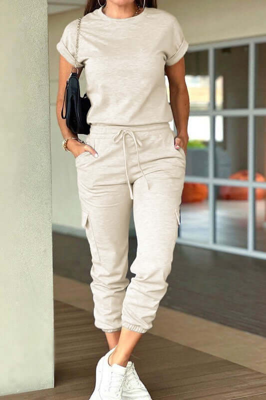 Crew Neck Short Sleeve Drawstring Waist Jumpsuit in light beige, perfect for casual wear and stylish outings.