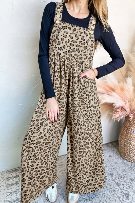 Leopard Bib Wide Leg Jumpsuit styled with a black top, featuring a trendy leopard print design and wide legs.
