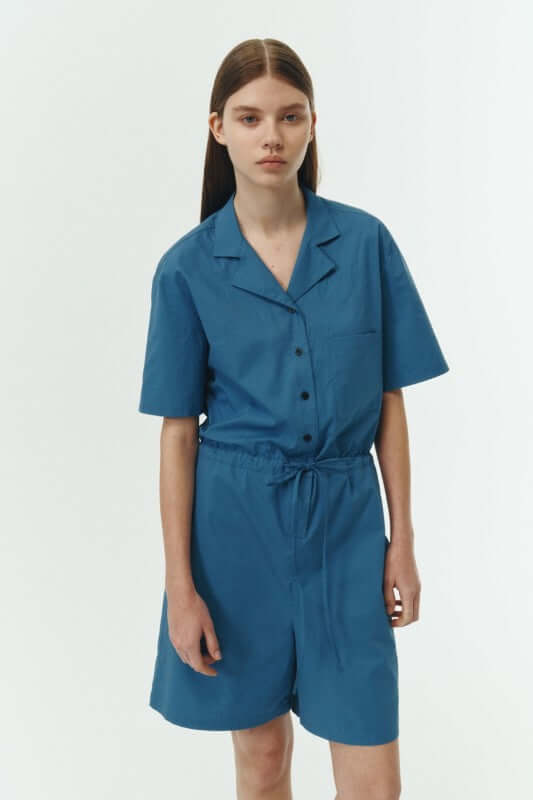 Emma Solid Jumpsuit in blue, featuring lightweight cotton material and a relaxed fit for all-day comfort.