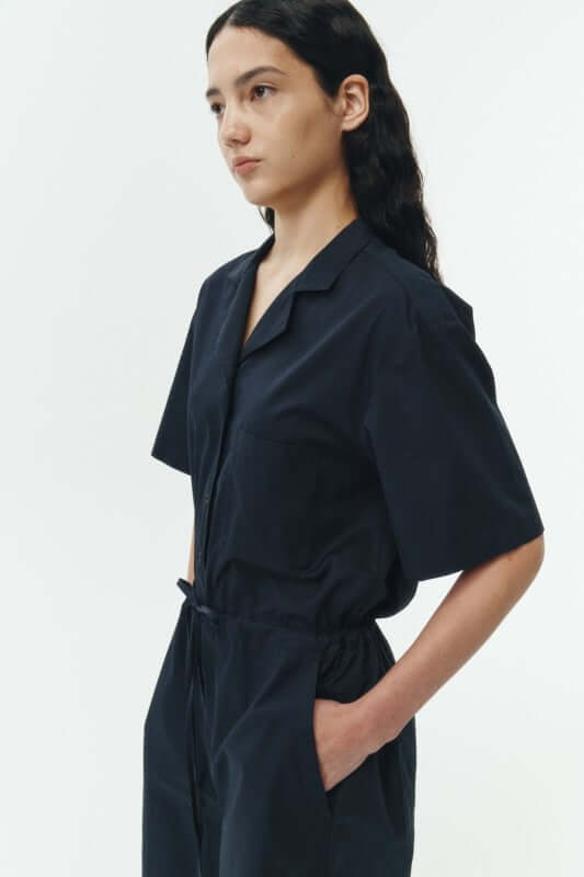 Emma Solid Jumpsuit displayed on model, showcasing breathable cotton fabric and relaxed fit.