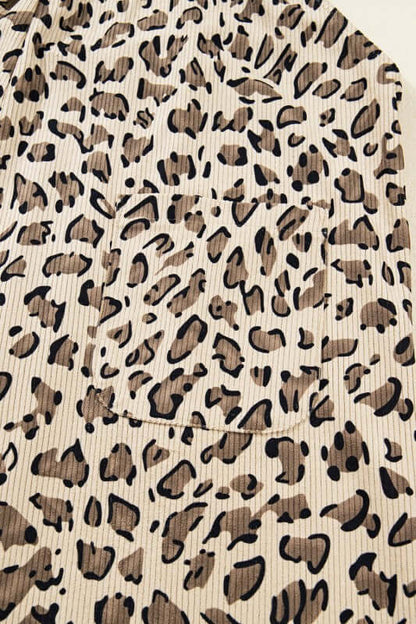 Close-up of the fabric pattern featuring leopard print on the Leopard Bib Wide Leg Jumpsuit.