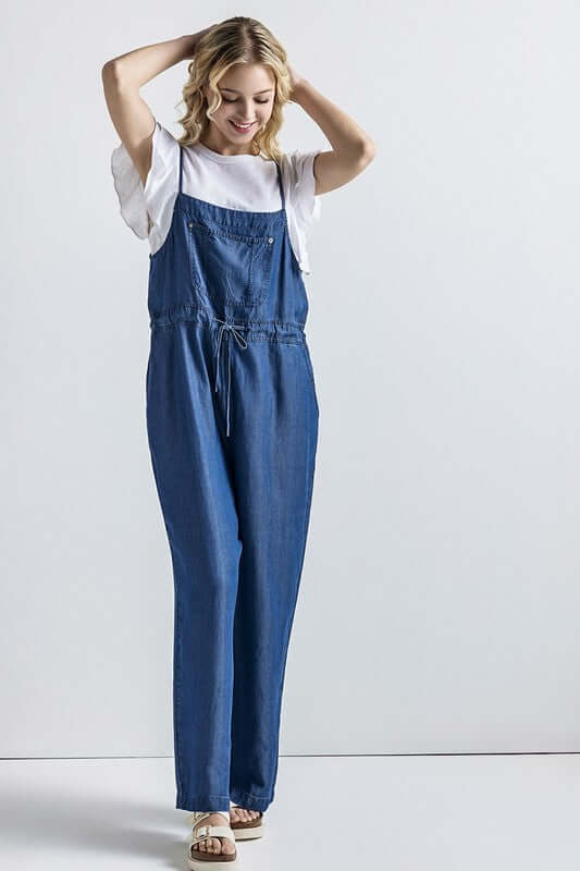 Model wearing Plus Pocket Adjustable Straps Overall Jumpsuit in denim, showcasing its comfortable fit and casual style.