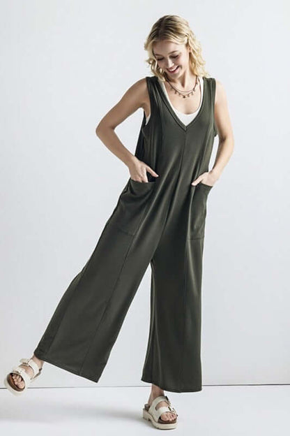 Oversized Patched Pocket V-Neck Jumpsuit displayed on model in olive green with oversized pockets and wide-leg pants.