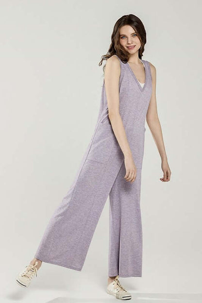 Oversized Patched Pocket V-Neck Jumpsuit in soft purple terry fabric, featuring wide-leg pants and a relaxed fit.