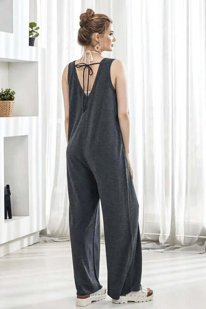 Oversized Patched Pocket V-Neck Jumpsuit featuring back drawstring detail and wide-leg pants.