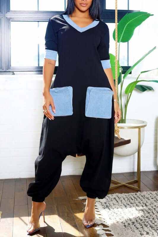 Stylish Denim Accent Jumpsuit featuring V-neckline and oversized denim pockets for a chic look.