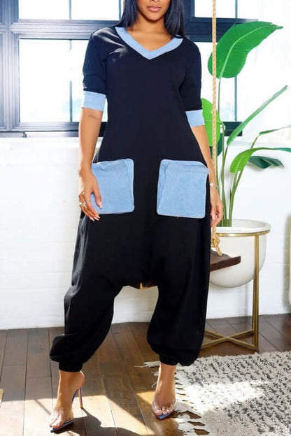 Stylish Denim Accent Jumpsuit featuring V-neckline and oversized denim pockets for a chic look.