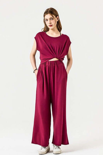 Open Front Wide Leg Jumpsuit in burgundy, featuring a trendy twist-front and practical side pockets.