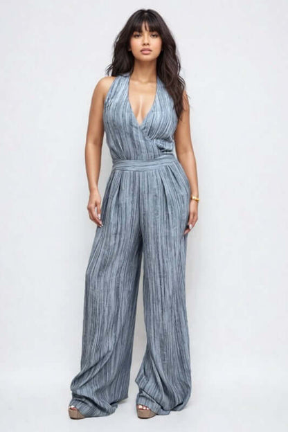 Skyline Halter Jumpsuit featuring a deep V-neckline and wide-leg trousers in a serene blue hue.