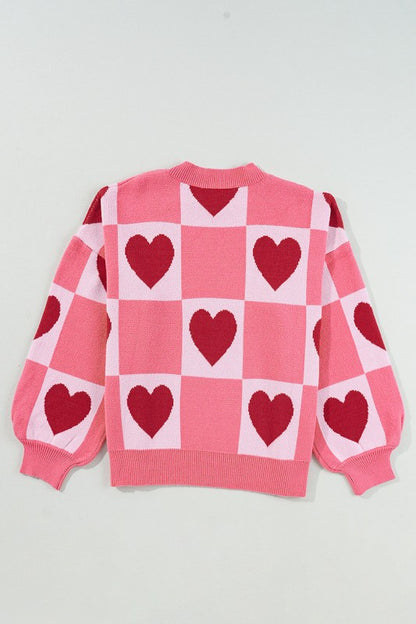 Love Heart Checkered Valentine Crew Neck Sweater with pink and red heart pattern, bubble sleeves, and crew neck; perfect for Valentine's Day.