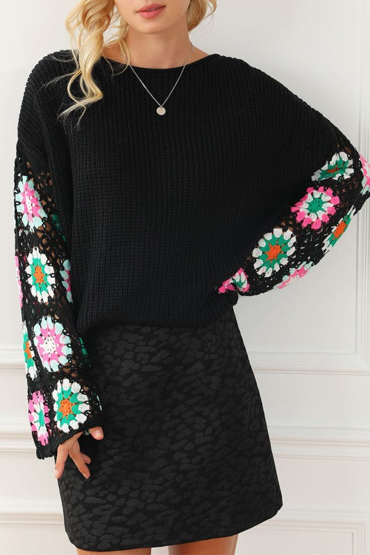 Black Floral Crochet Bell Sleeve Loose Sweater with colorful floral sleeve details and relaxed boat neckline fit.