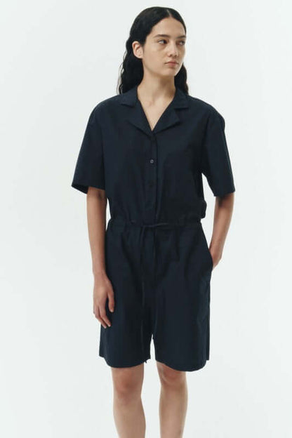Emma Solid Jumpsuit in navy with camp collar and relaxed fit, made from lightweight 100% cotton.