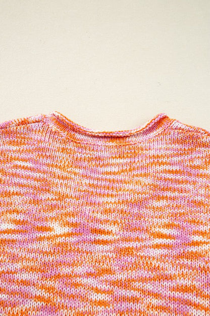 Vibrant abstract print of Sofia Shoulder Tunic Oversized Sweater with pink and orange pattern, drop shoulder design visible.