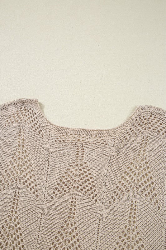 Close-up of Ava 8 Sleeve Casual Sweater's hollow out knit design, showcasing intricate patterns and soft fabric.