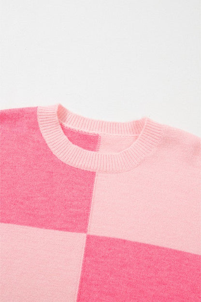 Detail of pink colorblock pattern on Abigail High Low Loose Sweater, showcasing the chic and feminine design.