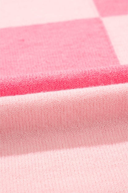 Close-up of pink stripes on Abigail High Low Loose Sweater fabric with colorblocking detail, showing texture and pattern.