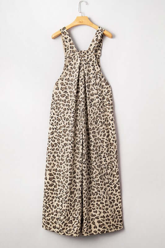 Leopard Bib Wide Leg Jumpsuit displayed on hanger with bold leopard print and wide-leg silhouette.