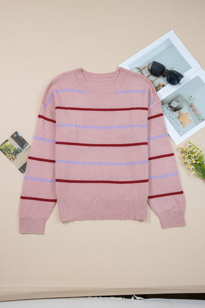 Stripe Ribbed Trim Drop Shoulder Sweater with pink and red stripes on a beige background, cozy and stylish for fall.