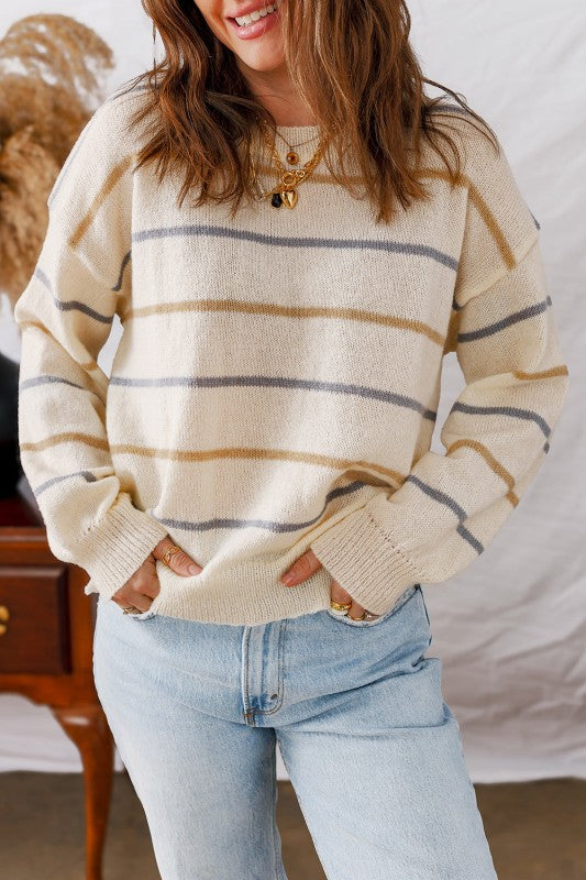 Woman wearing a Stripe Ribbed Trim Drop Shoulder Sweater with jeans