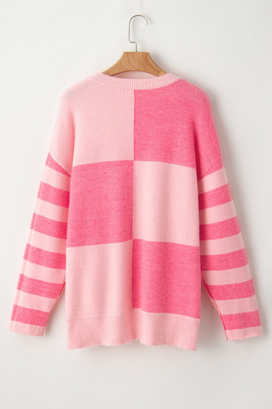 Abigail High Low Loose Sweater in pink with colorblocking and striped pattern, modern high-low hem, perfect casual wear.