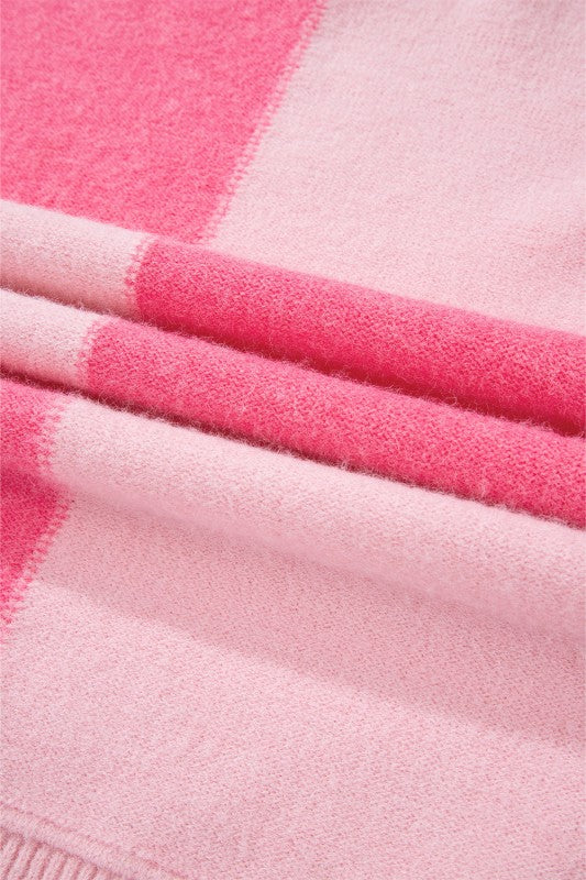 Close-up of the soft pink stripe detail on Abigail High Low Loose Sweater, highlighting the bold colorblocking design.