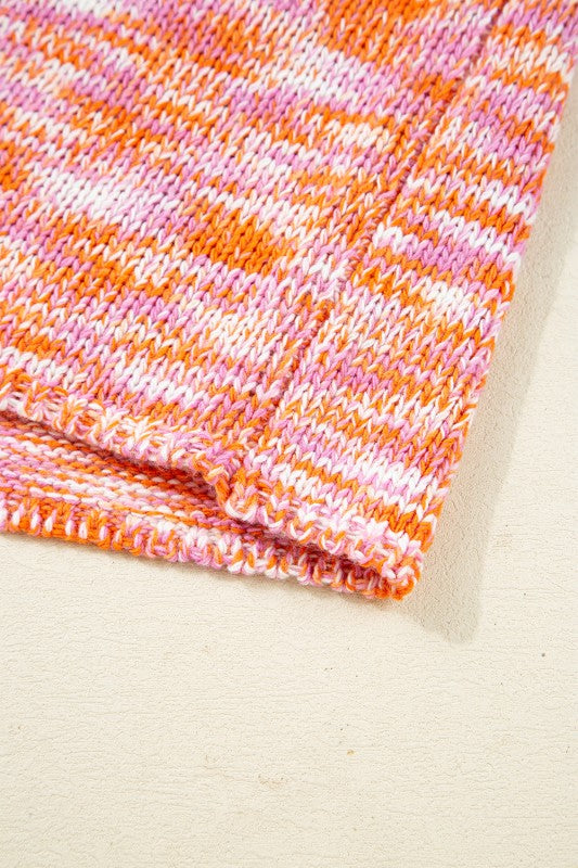 Close-up of vibrant knit fabric of Sofia Shoulder Tunic Oversized Sweater in abstract print, showcasing texture and color details.