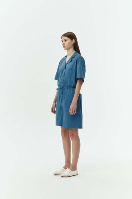 Emma Solid Jumpsuit worn by model, showcasing its lightweight and breathable cotton fabric in blue color.