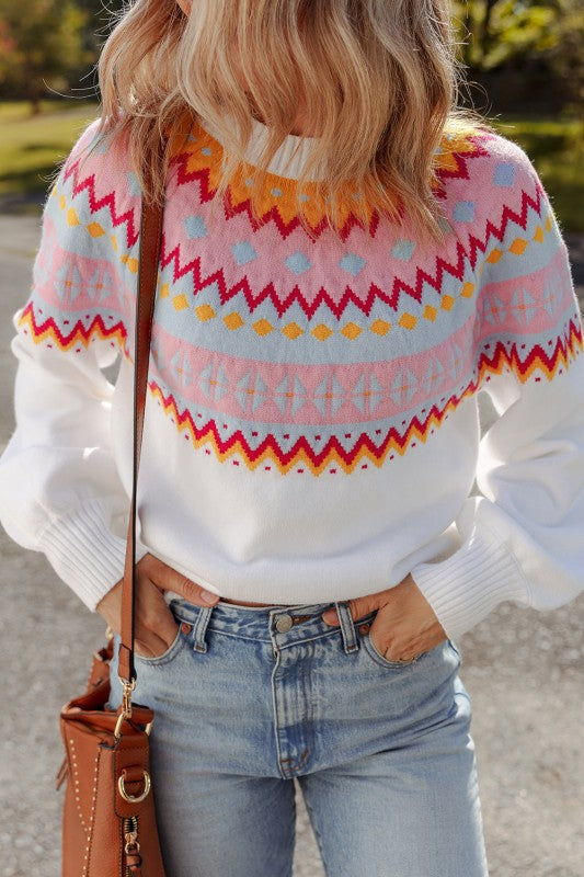 Woman wearing Avery Print Drop Shoulder Sweater with geometric ethnic design and colorblock pattern.