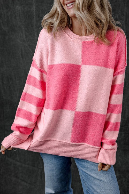Abigail High Low Loose Sweater in pink with bold colorblocking and stripes, showing relaxed fit and stylish high-low hem.