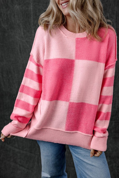 Abigail High Low Loose Sweater in pink with bold colorblocking and stripes, showing relaxed fit and stylish high-low hem.