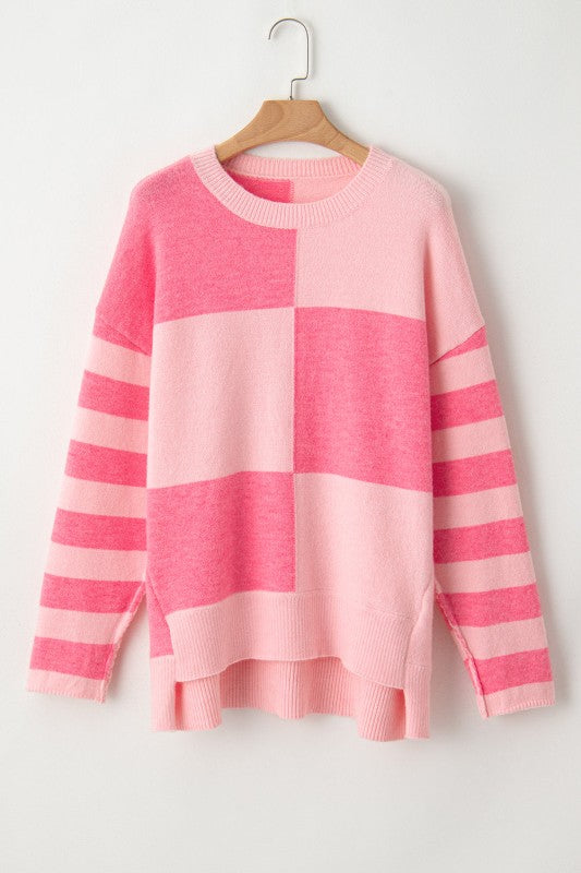 Abigail High Low Loose Sweater in pink with colorblocking and stripes, features a modern asymmetric silhouette for everyday style.