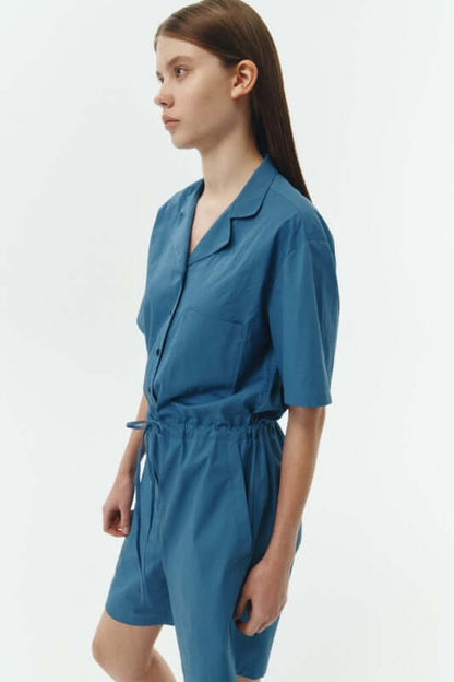 Emma Solid Jumpsuit in blue, featuring a camp collar and relaxed fit for all-day comfort.