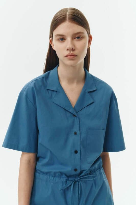 Emma Solid Jumpsuit in blue featuring a camp collar and relaxed fit for all-day comfort.