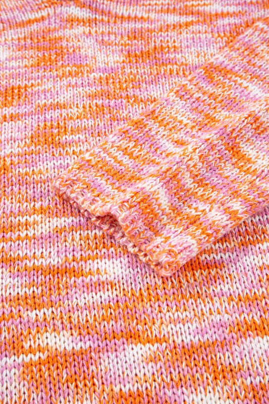 Close-up of Sofia Shoulder Tunic Oversized Sweater with vibrant abstract print and relaxed sleeve detail for a chic winter style.